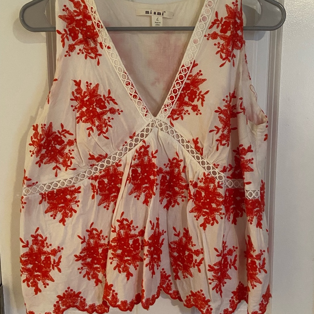 White and red pattern blouse. Deep v. Size M